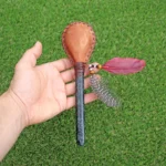 Skull Figure Shamanic Rattle | Handle part made of Machu Picchu Stone | Decorated with Domestic Feather | Peruvian Musical Instruments