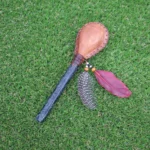 Skull Figure Shamanic Rattle | Handle part made of Machu Picchu Stone | Decorated with Domestic Feather | Peruvian Musical Instruments